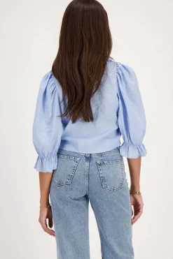 Blouse Bleue Avec Nœuds Et Col à Volants