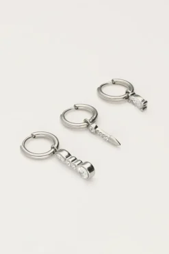 Lot De Trois Boucles D'oreilles Avec Charms Et Pierres Argentées