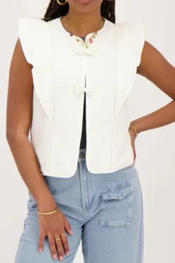 Veste Sans Manches Blanche Avec Nœuds Et Volants