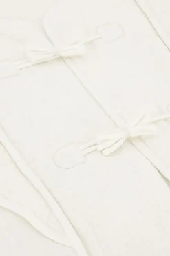 Veste Sans Manches Blanche Avec Nœuds Et Volants